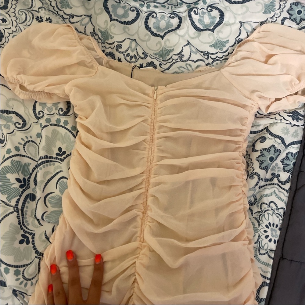 Slightly peachy white mini dress with scrunches and puff sleeves